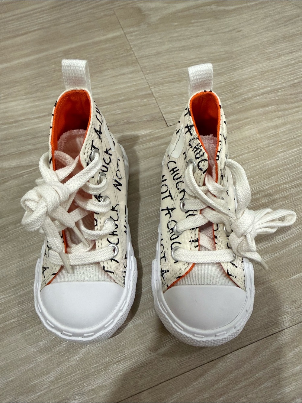 Converse Kids White Canvas High-Top Sneakers with Black Script and Orange Lining